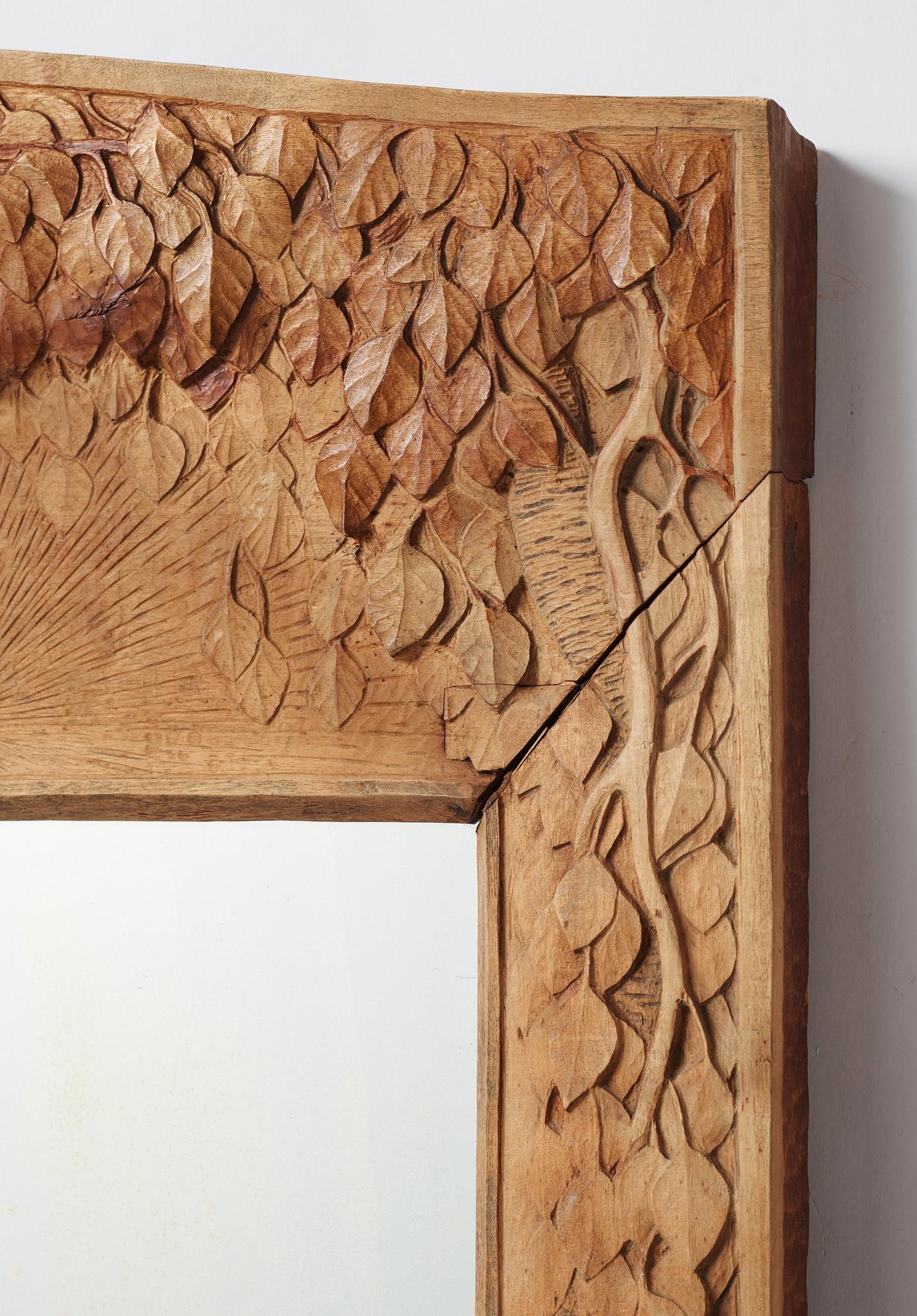 A Swedish Art Nouveau/ Folk art carved mirror, early 20th century.